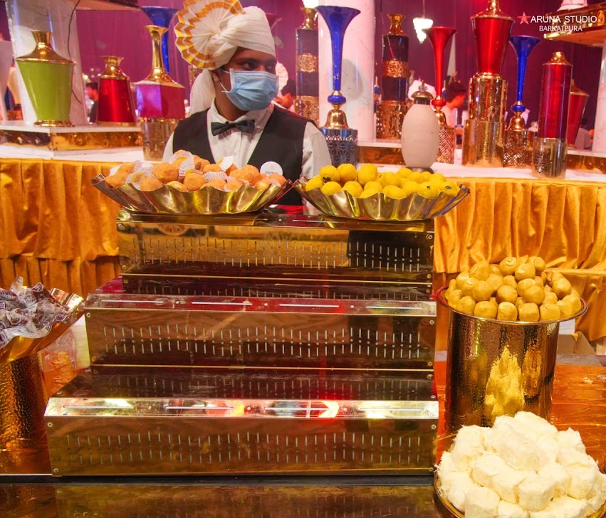 Traditional Indian sweets counter at a wedding
